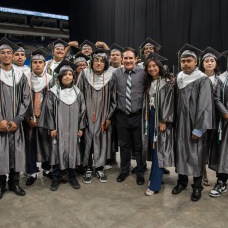 CAST STEM graduates pose with their teacher